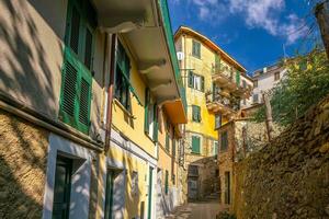 Colorful cityscape of buildings over Mediterranean sea, Europe, Cinque Terre in Italy photo