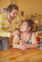 Mother and son sitting at a table photo