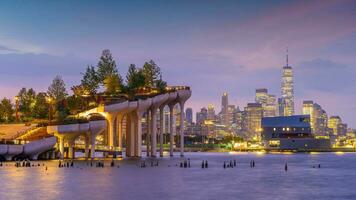 Cityscape of downtown Manhattan skyline with the Little Island Public Park in New York City at sunrise photo