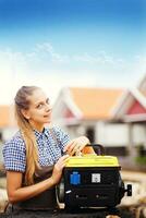 a woman is standing next to a portable generator photo