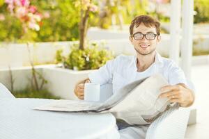 Man reading newspaper photo