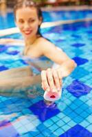 Young woman on the pool photo