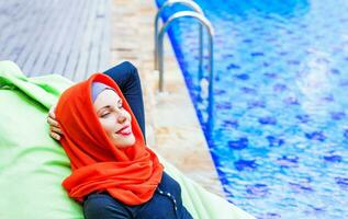 Young woman on the pool photo