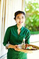 Asian woman serving local food photo