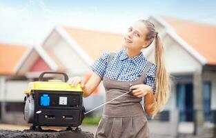 a woman is standing next to a portable generator photo