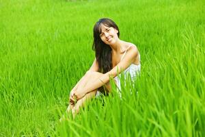 Woman in a green field photo