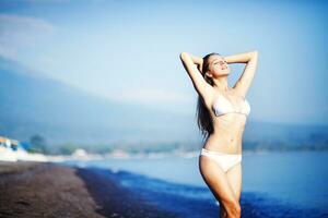 Beautiful woman on the beach photo