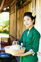 Asian woman serving local food photo