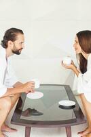 Man and woman having breakfast together photo