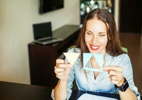 woman passing IQ test with paper shapes photo