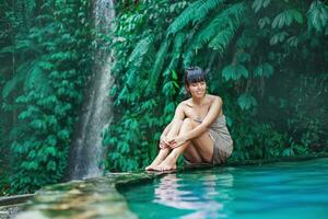 Beautiful woman by the pool photo