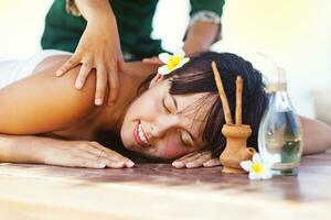 a woman laying on a wooden bench photo