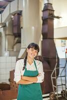 a woman in a green apron photo