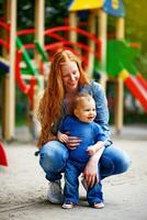 a woman holding a baby in the air photo