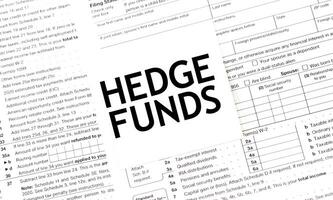 HEDGE FUNDS words on paper sheet with documents photo
