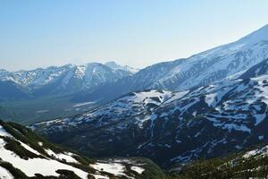 snow volcanoes in Kamchatka, snowy mountains photo