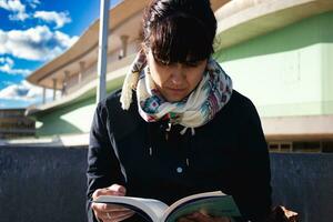 Woman reading book photo