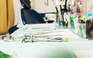 Set of dental tools on dentist's panel. Stomatologist tools close-up on table. Close up of dental tools on dentist's table, Dentist tools on the table photo