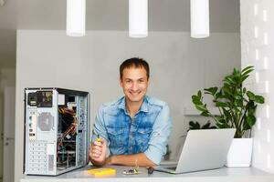 Computer engineer working on broken console in his office photo