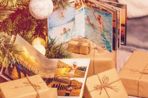 book together near Christmas tree in front of fireplace photo