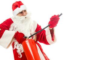 santa claus with fire extinguisher. Isolated on white background photo