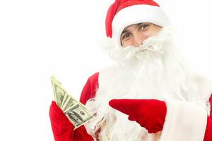Santa Claus holding money isolated on white background photo