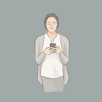 woman standing holding mobile phone using for texting chatting communicating or browsing website