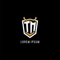 Initial TM geometric shield esport logo monogram design style vector
