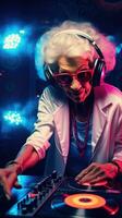 Bright elderly woman DJ at a rave. Techno party in the club. Grandma DJ. photo