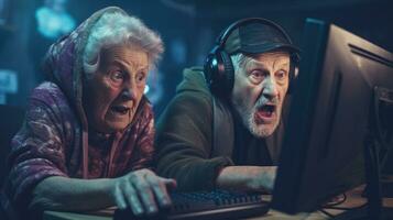 Funny elderly couple are playing computer games. Old gamers in a computer club. photo
