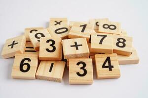 Number wood block cubes for learning Mathematic, education math concept. photo