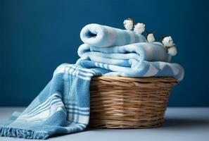 Laundry basket with clean towels on wooden table in the room AI Generated photo