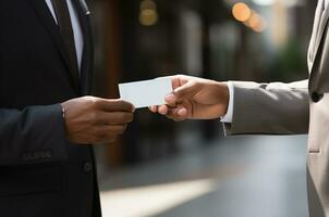 cropped shot of african american businessman giving business card to colleague AI Generated photo