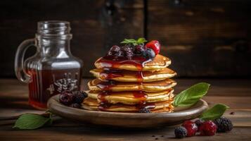 Stack of pancakes with fresh blueberry, raspberry and blackberry on brown plate photo