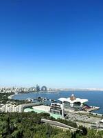 Seashore. View from mountain to sea. Baku, Azerbaijan. Mall. Pineapple-shaped building. View from hill. Mountain landscape, sea in distance. Beautiful natural view and famous building. Vertical photo