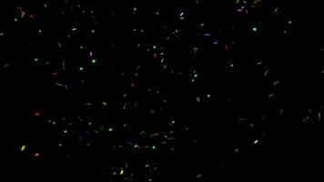 Colorful confetti explodes on a black background video