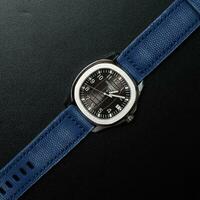 Surabaya, IDN, 2023 - Product photo of a luxury watch with a blue jeans canvas strap with black background
