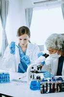 Scientist team meeting and writing analysis results in the laboratory study and analyze scientific sample for global warming, analytics and tech. photo
