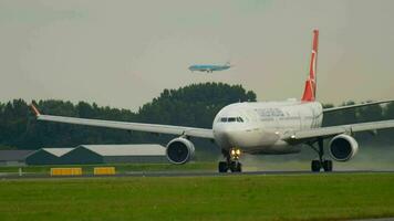 AMSTERDAM, THE NETHERLANDS JULY 25, 2017 - Turkish Airlines Airbus 330 TC JOF accelerate and take off at Polderbaan 36L, KLM Boeing 737 approaching at background. Shiphol Airport, Amsterdam Holland video