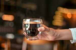 A glass of Black coffee in modern coffee shop photo