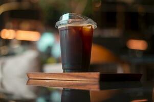 A glass of Black coffee in modern coffee shop photo