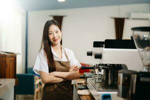 Startup successful small business owner sme woman stand with tablet  in cafe. woman barista cafe owner. photo