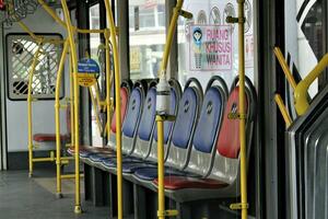 Jakarta, Indonesia-18 June 2023 Transjakarta bus seats with the theme of Transjakarta bus interiors photo