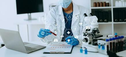 African Dctor work on digital tablet healthcare doctor technology tablet using computer  in laboratory study with virtual icon photo
