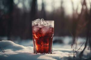 Cold iced winter drink in glass on snowy ground generative ai photo