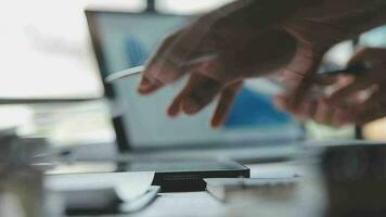 Financial Business team present. Business man hands hold documents with financial statistic stock photo, discussion, and analysis report data the charts and graphs. Finance Financial concept video