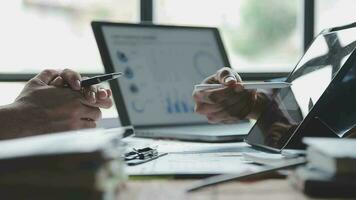 Financial Business team present. Business man hands hold documents with financial statistic stock photo, discussion, and analysis report data the charts and graphs. Finance Financial concept video
