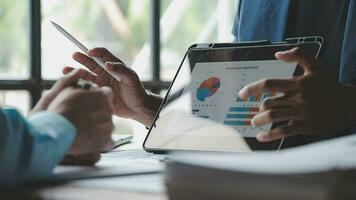 Financial Business team present. Business man hands hold documents with financial statistic stock photo, discussion, and analysis report data the charts and graphs. Finance Financial concept video