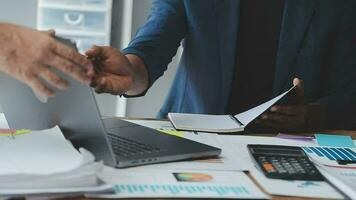 Financial Business team present. Business man hands hold documents with financial statistic stock photo, discussion, and analysis report data the charts and graphs. Finance Financial concept video