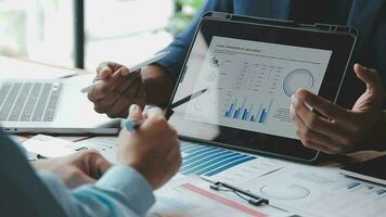 Financial Business team present. Business man hands hold documents with financial statistic stock photo, discussion, and analysis report data the charts and graphs. Finance Financial concept video